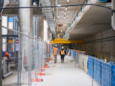 People walking in Arden station tunnel